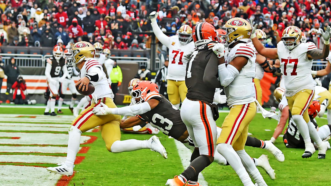 Nov 30, 2025; Cleveland, Ohio, USA;  San Francisco 49ers quarterback Brock Purdy (13) scores a touchdown during the second half against the Cleveland Browns at Huntington Bank Field. Mandatory Credit: Ken Blaze-Imagn Images