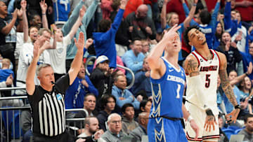 Creighton fans cheer while Bluejays guard Steven Ashworth blows his fingers after hitting a three-point shot as Louisville Cardinals guard Terrence Edwards Jr. reacts in the second half during the 2025 NCAA men's basketball tournament at Rupp Arena in Lexington, Kentucky.