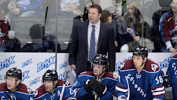 April 15 2013; Denver, CO, USA; Colorado Avalanche head coach Joe Sacco (center) on his bench with center Brad Malone (42) and right wing Milan Hejduk (23) and left wing Jamie McGinn (11) and left wing Patrick Bordeleau (58) during the first period of the game against the Edmonton Oilers at the Pepsi Center. Mandatory Credit: Ron Chenoy-Imagn Images