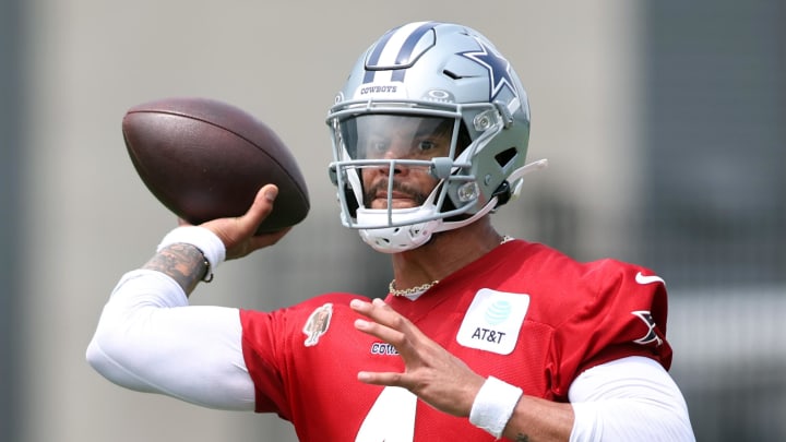 Jun 4, 2024; Frisco, TX, USA;  Dallas Cowboys quarterback Dak Prescott (4) goes through a drill during practice at the Ford Center at the Star Training Facility in Frisco, Texas. 