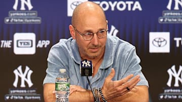 Aug 23, 2023; Bronx, New York, USA; New York Yankees general manager Brian Cashman talks with the media before the game between the Yankees and the Washington Nationals at Yankee Stadium. Mandatory Credit: Vincent Carchietta-Imagn Images