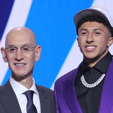Jun 25, 2025; Brooklyn, NY, USA;  Nique Clifford stands with NBA commissioner Adam Silver after being selected as the 24th pick by the Oklahoma City Thunder in the first round of the 2025 NBA Draft at Barclays Center. Mandatory Credit: Brad Penner-Imagn Images