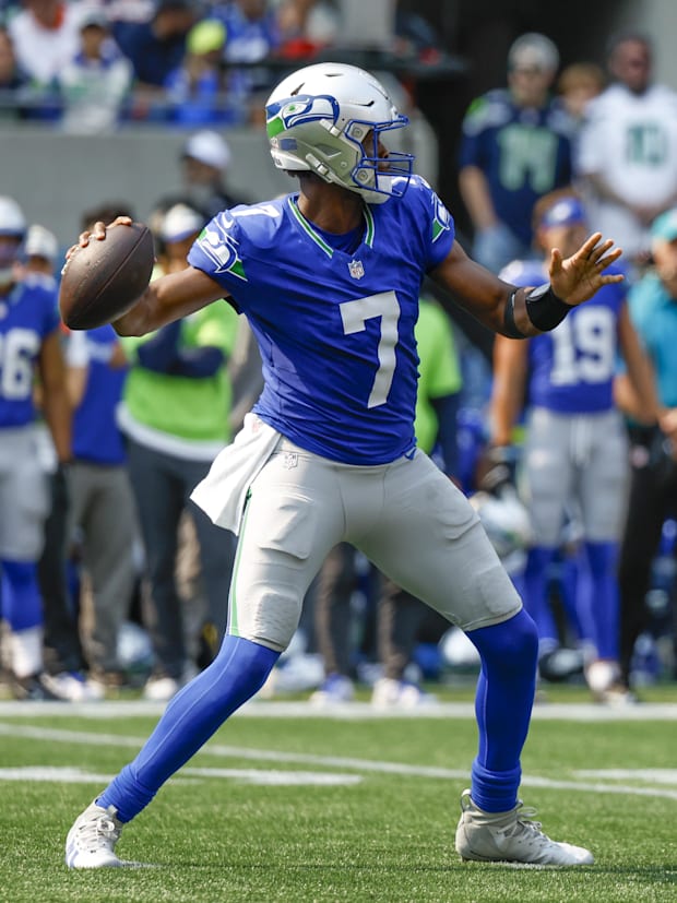 Seattle Seahawks quarterback Geno Smith passes against the Denver Broncos during the second quarter at Lumen Field.