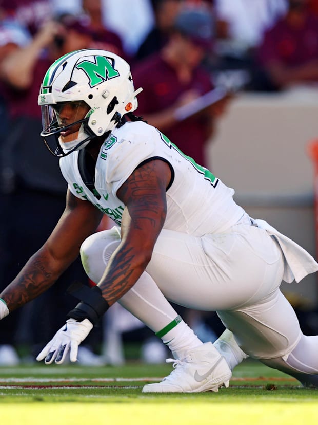 Marshall Thundering Herd defensive lineman Mike Green (15) celebrates after sacking Virginia Tech Hokies quarterback.