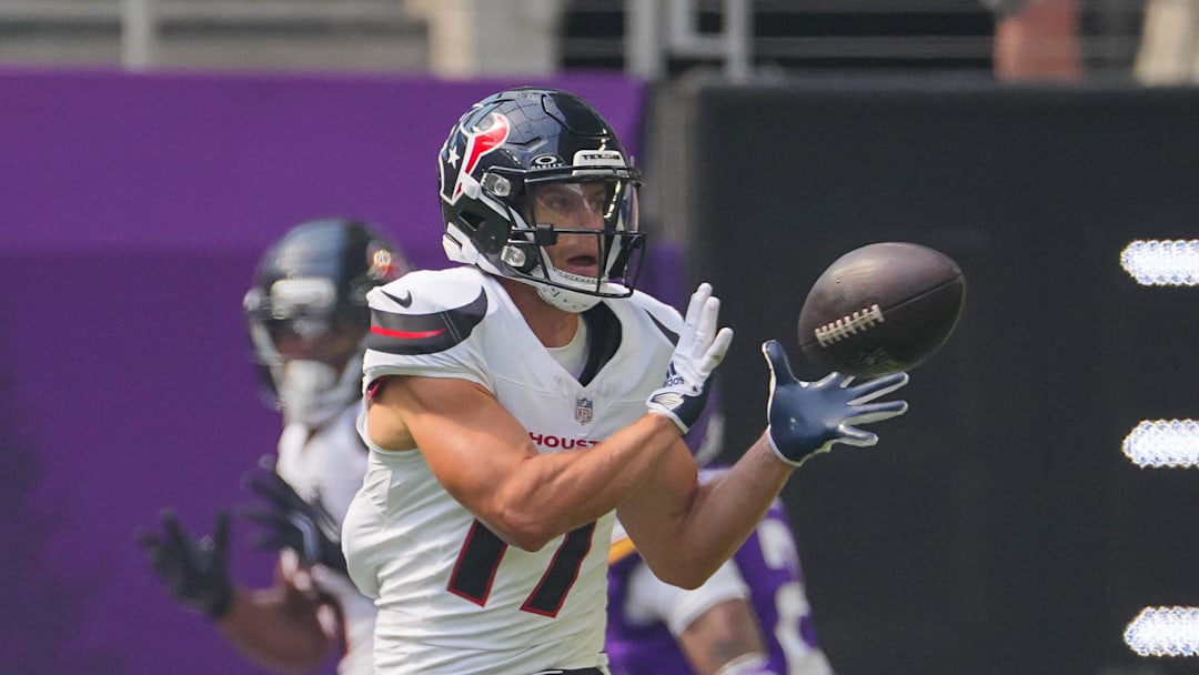 Aug 9, 2025; Minneapolis, Minnesota, USA; Houston Texans wide receiver Braxton Berrios (17) catches a pass for a touchdown against the Minnesota Vikings in the first quarter at U.S. Bank Stadium. Mandatory Credit: Brad Rempel-Imagn Images