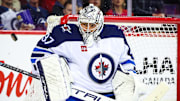 Oct 4, 2024; Calgary, Alberta, CAN; Winnipeg Jets goaltender Connor Hellebuyck (37) makes a save against the Calgary Flames during the second period at Scotiabank Saddledome. Mandatory Credit: Sergei Belski-Imagn Images