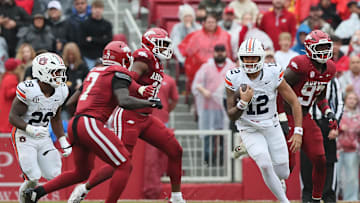 Oct 25, 2025; Fayetteville, Arkansas, USA; Auburn Tigers quarterback Ashton Daniels 912) rushes during the second quarter against the Arkansas Razorbacks at Donald W. Reynolds Razorback Stadium. Mandatory Credit: Nelson Chenault-Imagn Images