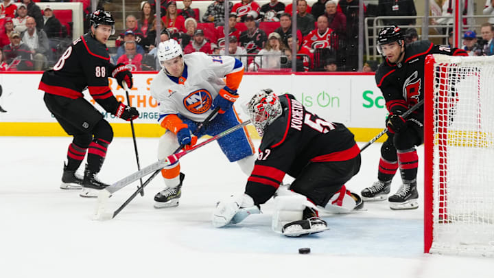 Dec 17, 2024; Raleigh, North Carolina, USA; New York Islanders center Mathew Barzal (13) shoots against Carolina Hurricanes goaltender Pyotr Kochetkov (52) during the second period at Lenovo Center. Mandatory Credit: James Guillory-Imagn Images Dec 17, 2024; Raleigh, North Carolina, USA; New York Islanders center Mathew Barzal (13) shoots against Carolina Hurricanes goaltender Pyotr Kochetkov (52) during the second period at Lenovo Center. Mandatory Credit: James Guillory-Imagn Images