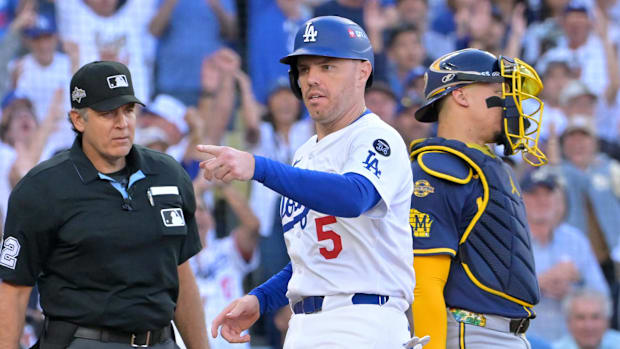 Los Angeles Dodgers first baseman Freddie Freeman (5) celebrates scoring after a throwing error.