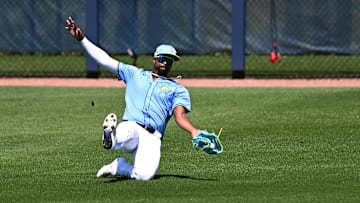 Mar 13, 2025; Port Charlotte, Florida, USA; Tampa Bays Rays left fielder Eloy Jimenez (74) catches a line drive in the third inning against the Washington Nationals during spring training at Charlotte Sports Park. Mandatory Credit: Jonathan Dyer-Imagn Images