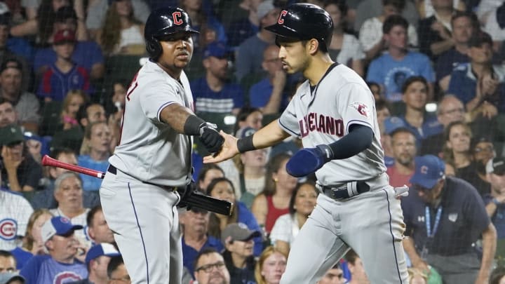 Jul 1, 2023; Chicago, Illinois, USA; Cleveland Guardians left fielder Steven Kwan (38) is greeted by third baseman Jose Ramirez (11) after scoring against the Chicago Cubs during the third inning at Wrigley Field. Mandatory Credit: David Banks-USA TODAY Sports