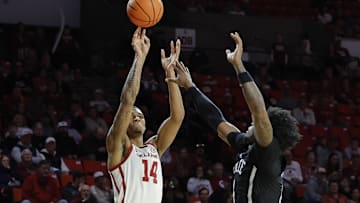Feb 22, 2025; Norman, Oklahoma, USA;  Oklahoma Sooners forward Jalon Moore (14) shoots a three point basket against the Mississippi State Bulldogs during the second half at Lloyd Noble Center. Mandatory Credit: Alonzo Adams-Imagn Images