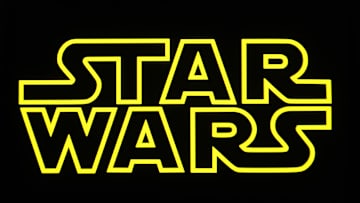 In this photo illustration, a Star Wars logo is seen on a...