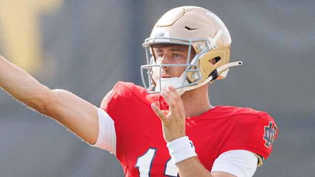 CJ Carr throws a pass at Notre Dame's fal practice