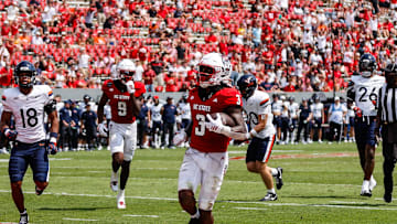 Sep 6, 2025; Raleigh, North Carolina, USA; North Carolina State Wolfpack running back Hollywood Smothers (3) runs with the football to score a touchdown during the second half of the game against Virginia Cavaliers at Carter-Finley Stadium. Mandatory Credit: Jaylynn Nash-Imagn Images