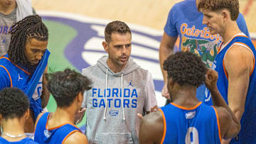 Florida head coach Todd Golden, center, gets the program started during afternoon basketball practice at the Florida Basketball Practice Facility in Gainesville, FL on Tuesday, September 30, 2025. [Alan Youngblood/Gainesville Sun]