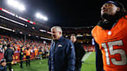 Nov 30, 2025; Landover, Maryland, USA; Denver Broncos head coach Sean Payton walks off the field with linebacker Nik Bonitto (15) after the game against the Washington Commanders at Northwest Stadium. 