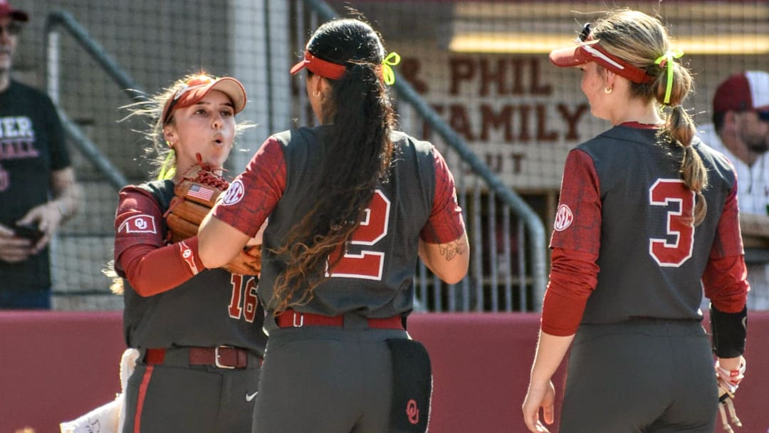Oklahoma outfielder Abby Dayton, left, with Nelly McEnroe-Marinas and Chaney Helton. With McEnroe-Marinas out for the season, Dayton, normally an outfielder, has worked at third base.