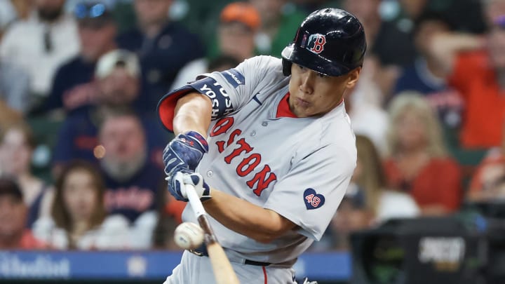 Aug 21, 2024; Houston, Texas, USA; Boston Red Sox designated hitter Masataka Yoshida (7) hits a single against the Houston Astros in the seventh inning at Minute Maid Park. Mandatory Credit: Thomas Shea-USA TODAY Sports