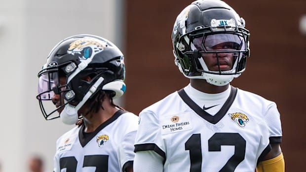 Jacksonville Jaguars wide receiver J.J. Jones (87) and Jacksonville Jaguars wide receiver Travis Hunter (12) take a breather 
