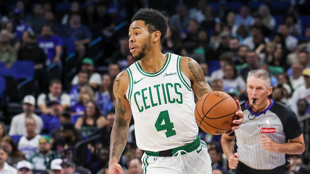 Nov 9, 2025; Orlando, Florida, USA; Boston Celtics guard Anfernee Simons (4) brings the ball up court during the second quarter against the Orlando Magic at Kia Center. Mandatory Credit: Mike Watters-Imagn Images