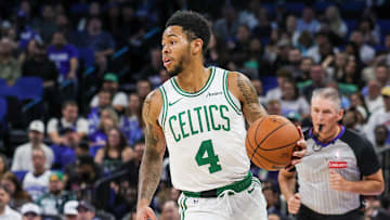 Nov 9, 2025; Orlando, Florida, USA; Boston Celtics guard Anfernee Simons (4) brings the ball up court during the second quarter against the Orlando Magic at Kia Center. Mandatory Credit: Mike Watters-Imagn Images