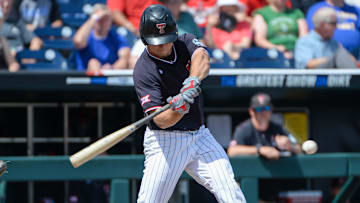 Texas Tech Red Raiders infielder Dru Baker (4) drives in a run in the sixth inning against the Michigan Wolverines in the 2019 College World Series at TD Ameritrade Park . Mandatory Credit: Steven Branscombe-Imagn Images