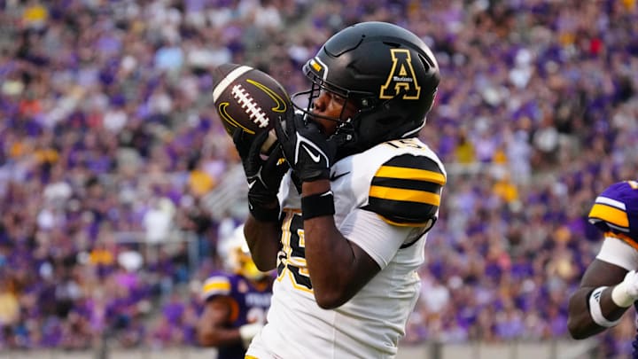 Sep 14, 2024; Greenville, North Carolina, USA;  Appalachian State Mountaineers wide receiver Makai Jackson (15) makes a touchdown catch against the East Carolina Pirates during the second half at Dowdy-Ficklen Stadium