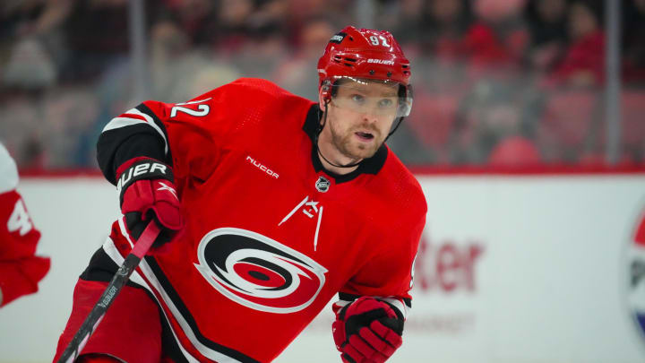 Mar 28, 2024; Raleigh, North Carolina, USA;  Carolina Hurricanes center Evgeny Kuznetsov (92) skates against the Detroit Red Wings during the second periodat PNC Arena. Mandatory Credit: James Guillory-USA TODAY Sports