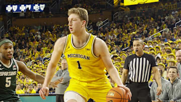 Feb 21, 2025; Ann Arbor, Michigan, USA; Michigan Wolverines center Danny Wolf (1) handles the ball during the first half of the game against the Michigan State Spartans at Crisler Center. Mandatory Credit: Brian Bradshaw Sevald-Imagn Images