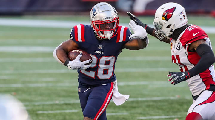 Nov 29, 2020; Foxborough, Massachusetts, USA; New England Patriots running back James White (28) runs the ball against the Arizona Cardinals during the second half at Gillette Stadium. Mandatory Credit: Paul Rutherford-Imagn Images