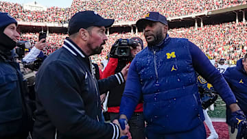 Ohio State Buckeyes head coach Ryan Day shakes hands with Michigan Wolverines head coach Sherrone Moore following the NCAA football game at Ohio Stadium in Columbus on Saturday, Nov. 30, 2024. Michigan won 13-10.