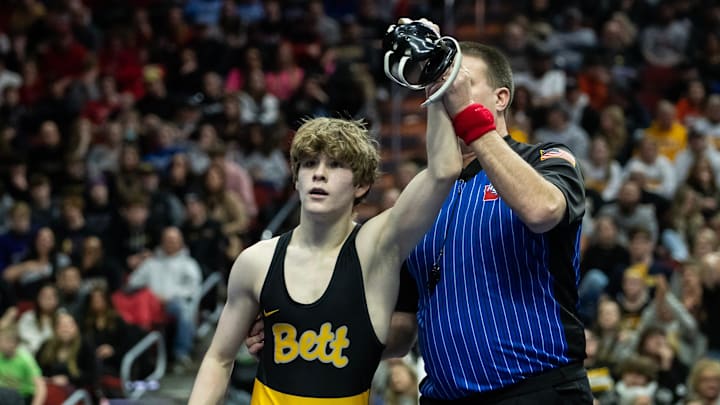 Jake Knight of Bettendorf has his hand raised after winning the 2023 Iowa Class 3A 113-pound state wrestling championship. He has committed to wrestle in college at the University of Oklahoma.