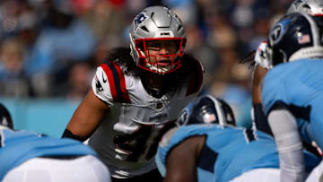 Oct 19, 2025; Nashville, Tennessee, USA;  New England Patriots linebacker Jahlani Tavai (48) sneaks a peak into the backfield against the Tennessee Titans during the second half at Nissan Stadium. Mandatory Credit: Steve Roberts-Imagn Images