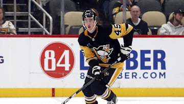 Oct 4, 2024; Pittsburgh, Pennsylvania, USA;  Pittsburgh Penguins defenseman Harrison Brunicke (45) skates with the puck against the Columbus Blue Jackets during the third period at PPG Paints Arena. Mandatory Credit: Charles LeClaire-Imagn Images