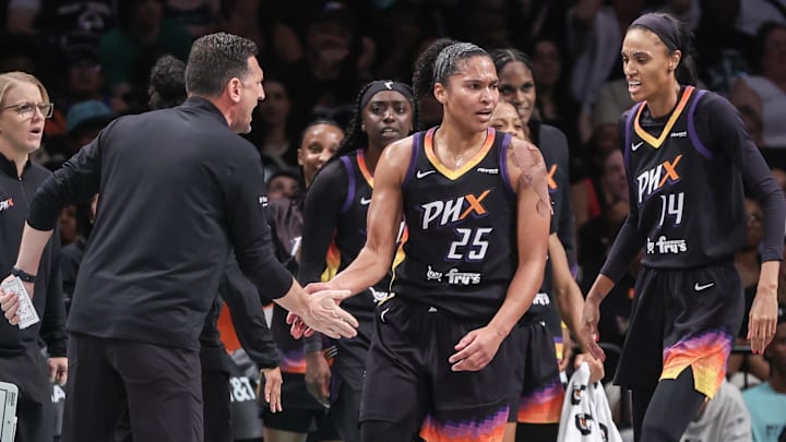 Jul 25, 2025; Brooklyn, New York, USA; Phoenix Mercury forward Alyssa Thomas (25) celebrates with head coach Nate Tibbets and forward DeWanna Bonner (14) after scoring in the first quarter against the New York Liberty at Barclays Center. Mandatory Credit: Wendell Cruz-Imagn Images Jul 25, 2025; Brooklyn, New York, USA; Phoenix Mercury forward Alyssa Thomas (25) celebrates with head coach Nate Tibbets and forward DeWanna Bonner (14) after scoring in the first quarter against the New York Liberty at Barclays Center. Mandatory Credit: Wendell Cruz-Imagn Images