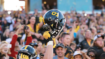 Sep 12, 2015; Ames, IA, USA;  The Iowa Hawkeyes wore helmets with #9 on them to honor the late Tyler Sash who died early this week.  Sash played safety for the Hawkeyes and won a Superbowl with the New York Giants.  Iowa beat the Iowa State Cyclones 31-17 at Jack Trice Stadium.  Mandatory Credit: Reese Strickland-Imagn Images