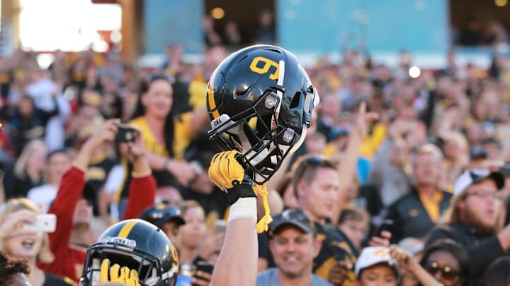 Sep 12, 2015; Ames, IA, USA;  The Iowa Hawkeyes wore helmets with #9 on them to honor the late Tyler Sash who died early this week.  Sash played safety for the Hawkeyes and won a Superbowl with the New York Giants.  Iowa beat the Iowa State Cyclones 31-17 at Jack Trice Stadium.  Mandatory Credit: Reese Strickland-Imagn Images