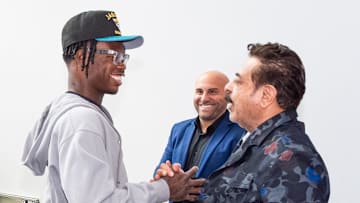 The Jacksonville Jaguars first-round pick, Colorado Buffaloes wide receiver and defensive back Travis Hunter, left, was greeted by Jaguars owner Shahid Khan after Hunter arrived on Friday, March 25, 2025 at Miller Electric Center in Jacksonville, Fla. 
