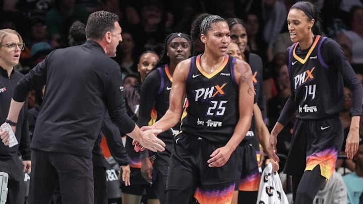 Jul 25, 2025; Brooklyn, New York, USA;  Phoenix Mercury forward Alyssa Thomas (25) celebrates with head coach Nate Tibbets and forward DeWanna Bonner (14) after scoring in the first quarter against the New York Liberty at Barclays Center. Mandatory Credit: Wendell Cruz-Imagn Images