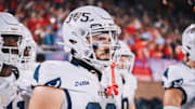 Bobby Salla Jr. looking at the field prior to their matchup against the Liberty Flames