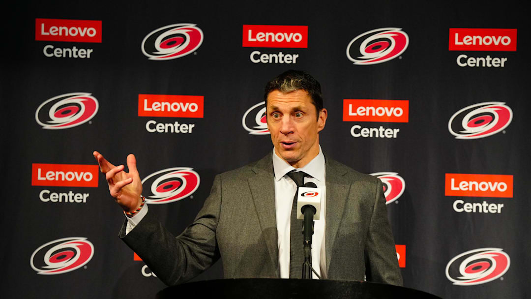 Dec 28, 2024; Raleigh, North Carolina, USA;  Carolina Hurricanes head coach Rod Brind’Amour talks to the press after winning his 300th game against the New Jersey Devils at Lenovo Center. Mandatory Credit: James Guillory-Imagn Images