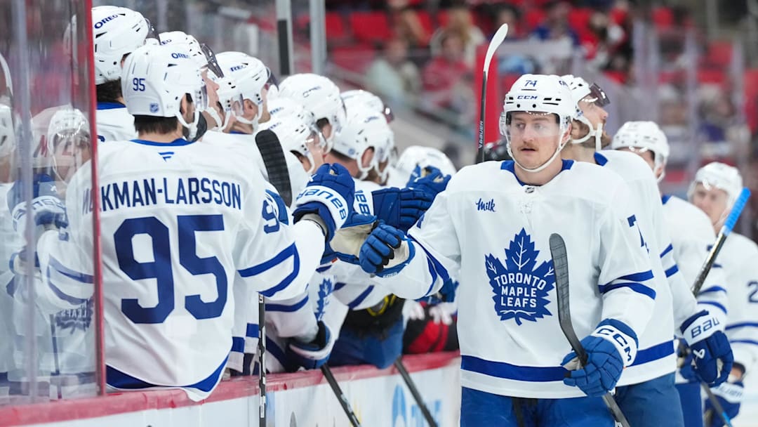 Dec 4, 2025; Raleigh, North Carolina, USA; Toronto Maple Leafs center Bobby McMann (74) celebrates his goal against the Carolina Hurricanes during the first period at Lenovo Center. Mandatory Credit: James Guillory-Imagn Images