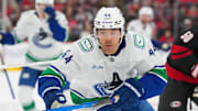 Nov 14, 2025; Raleigh, North Carolina, USA;  Vancouver Canucks left wing Kiefer Sherwood (44) skates against the Carolina Hurricanes during the second period at Lenovo Center. Mandatory Credit: James Guillory-Imagn Images