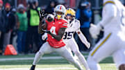 Ohio State wide receiver Jeremiah Smith (4) makes a catch against Michigan defensive back Jyaire Hill (35) during the first half at Ohio Stadium in Columbus, Ohio on Saturday, Nov. 30, 2024.