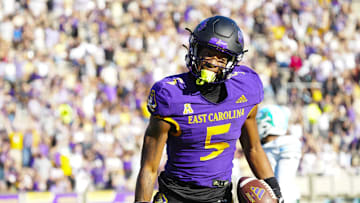 Nov 4, 2023; Greenville, North Carolina, USA;  East Carolina Pirates wide receiver Chase Sowell (5) reacts to his catch against the Tulane Green Wave during the first half at Dowdy-Ficklen Stadium. Mandatory Credit: James Guillory-Imagn Images