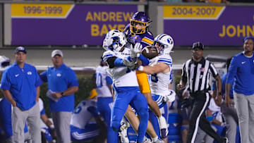 Sep 20, 2025; Greenville, North Carolina, USA;  Brigham Young Cougars cornerback Therrian Alexander III (1) and safety Tanner Wall (28) break up the pass attempt to East Carolina Pirates tight end Jayvontay Conner (8) during the first half at Dowdy-Ficklen Stadium. Mandatory Credit: James Guillory-Imagn Images