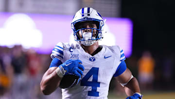 Sep 20, 2025; Greenville, North Carolina, USA;  Brigham Young Cougars running back LJ Martin (4) runs for a touchdown against the East Carolina Pirates during the second half at Dowdy-Ficklen Stadium. Mandatory Credit: James Guillory-Imagn Images
