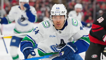 Nov 14, 2025; Raleigh, North Carolina, USA;  Vancouver Canucks left wing Kiefer Sherwood (44) skates against the Carolina Hurricanes during the second period at Lenovo Center. Mandatory Credit: James Guillory-Imagn Images