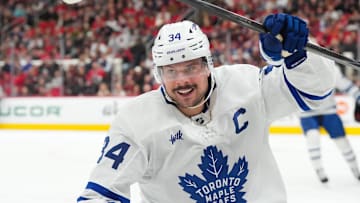 Dec 4, 2025; Raleigh, North Carolina, USA; Toronto Maple Leafs center Auston Matthews (34) celebrates his goal against the Carolina Hurricanes during the second period at Lenovo Center. Mandatory Credit: James Guillory-Imagn Images